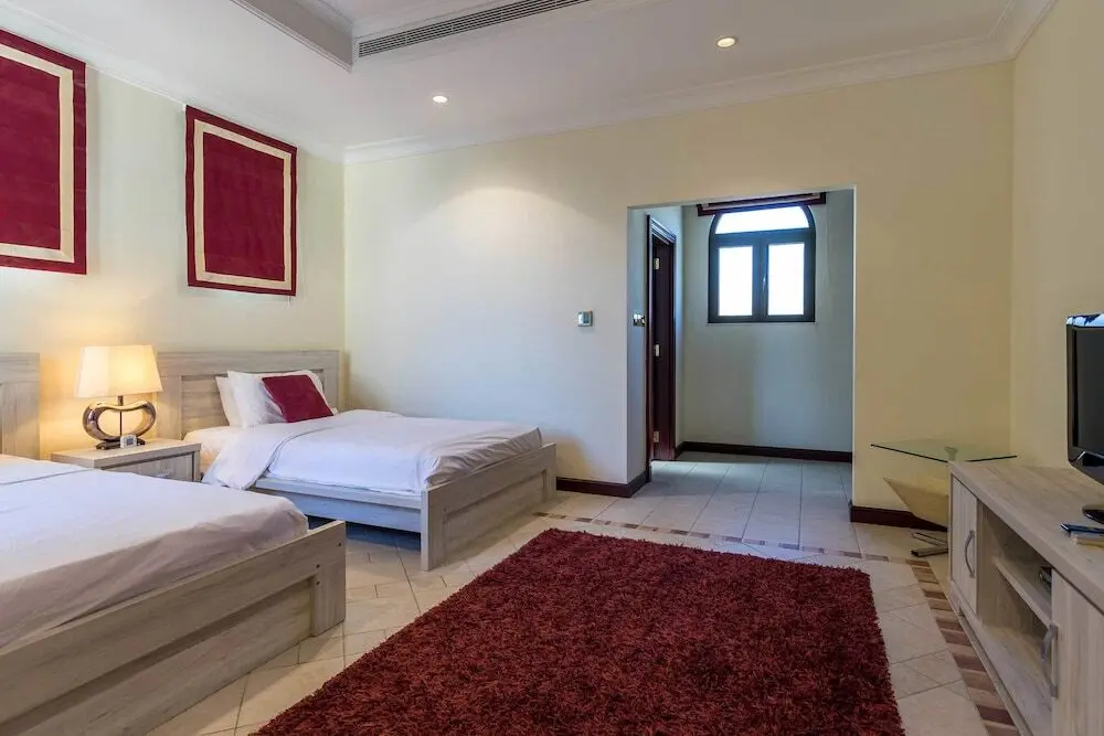 Дубай: 5 Bedroom Garden Villa at Frond E by Deluxe Holiday Homes
