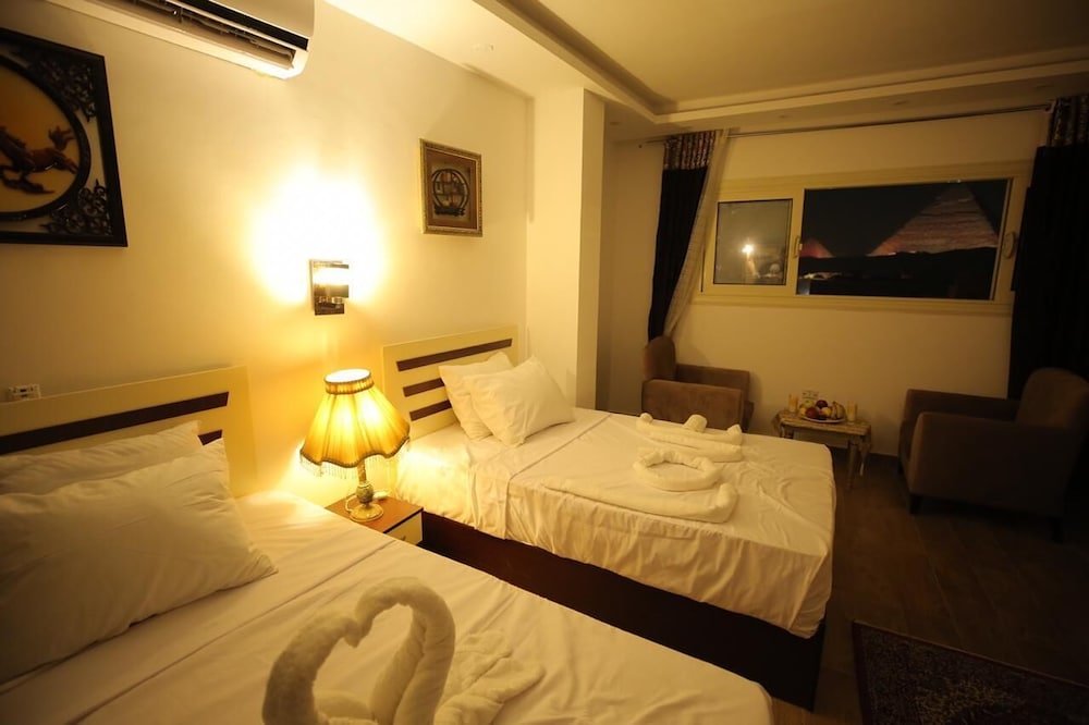 Гиза: The Lotus Guest House - 3 Pyramids View