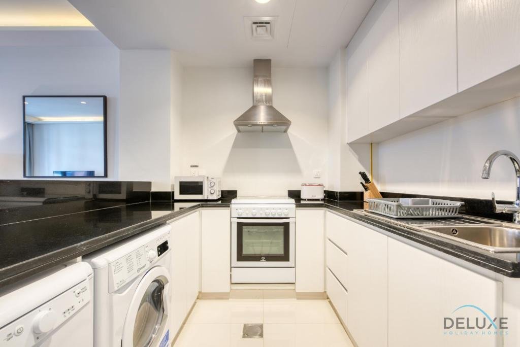 Дубай: Sleek 1BR Apartment at Celestia Dubai South by Deluxe Holiday Homes