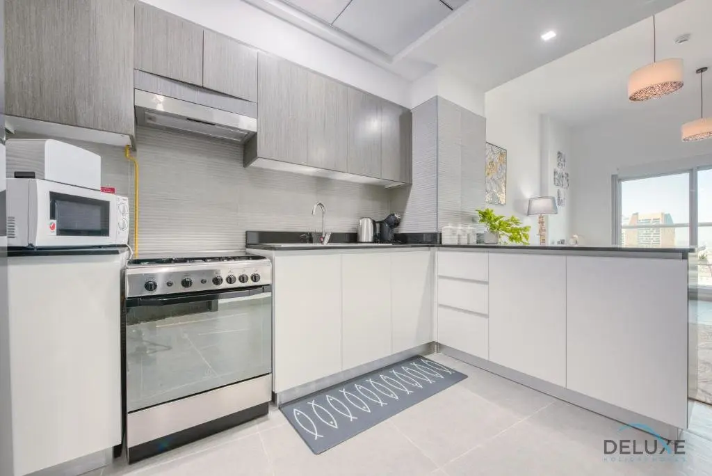 Дубай: Gleeful 1BR in Bella Rose Al Barsha South by Deluxe Holiday Homes