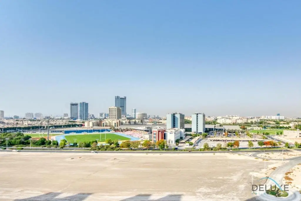 Дубай: Sunny 1BR at Canal Residences West Dubai Sports City by Deluxe Holiday Homes