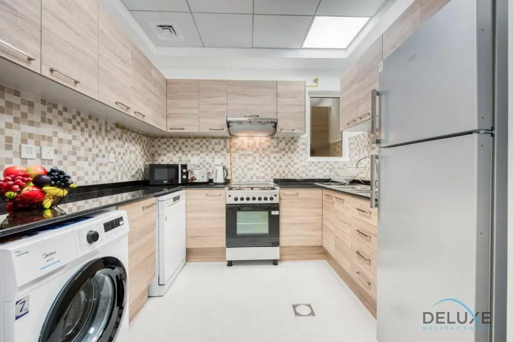Vivid 2BR at Canal Residences West Dubai Sports City by Deluxe Holiday Homes — фото 1