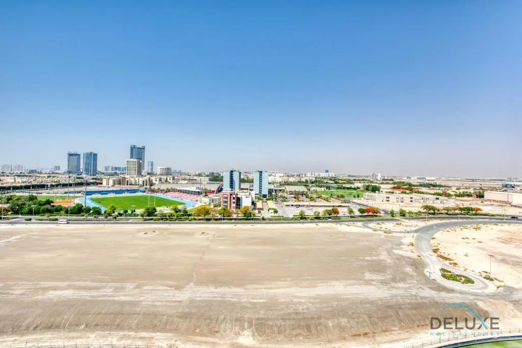 Дубай: Vivid 2BR at Canal Residences West Dubai Sports City by Deluxe Holiday Homes