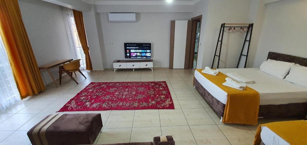 Фетхие: 3+1 sea1km 125mt2 Furnished luxury apartment 1.kat