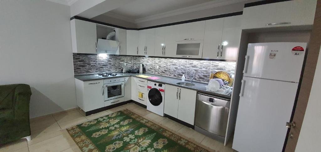 Фетхие: 3+1 sea1km 125mt2 Furnished luxury apartment 1.kat