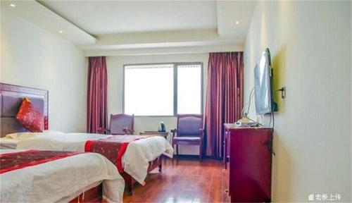 Лешан: Emeishan Sanyuan Shuzhuang Home Stay