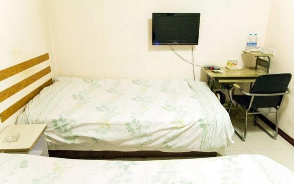 Таншань: Huatian Express Inn