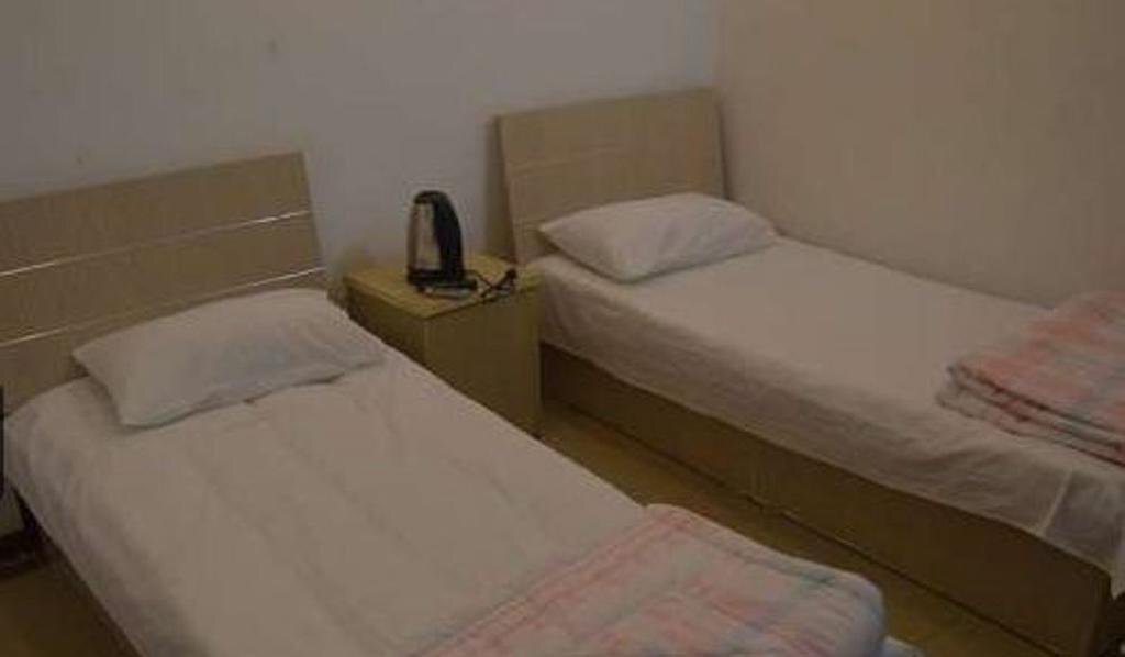 Циндао: Qingdao Guanglongju Inn