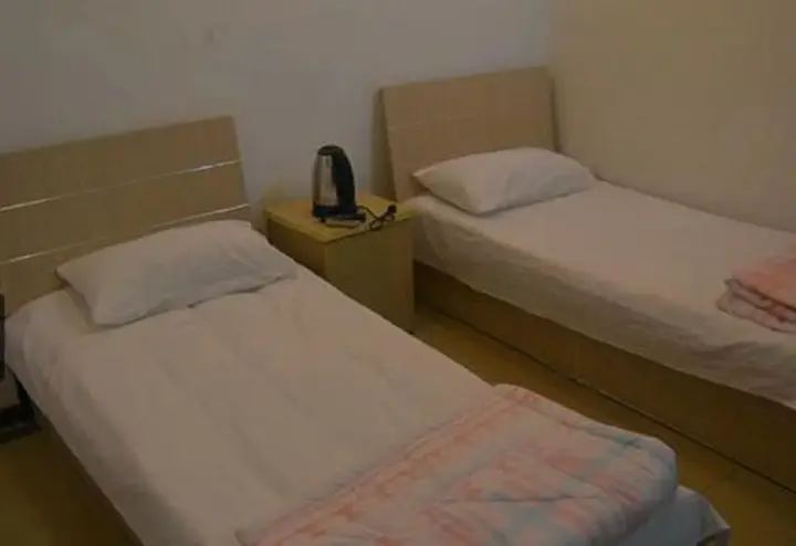 Циндао: Qingdao Guanglongju Inn