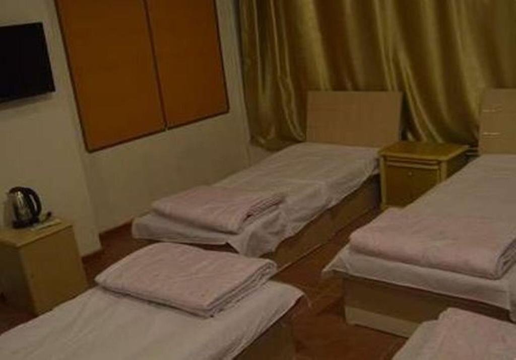 Циндао: Qingdao Guanglongju Inn