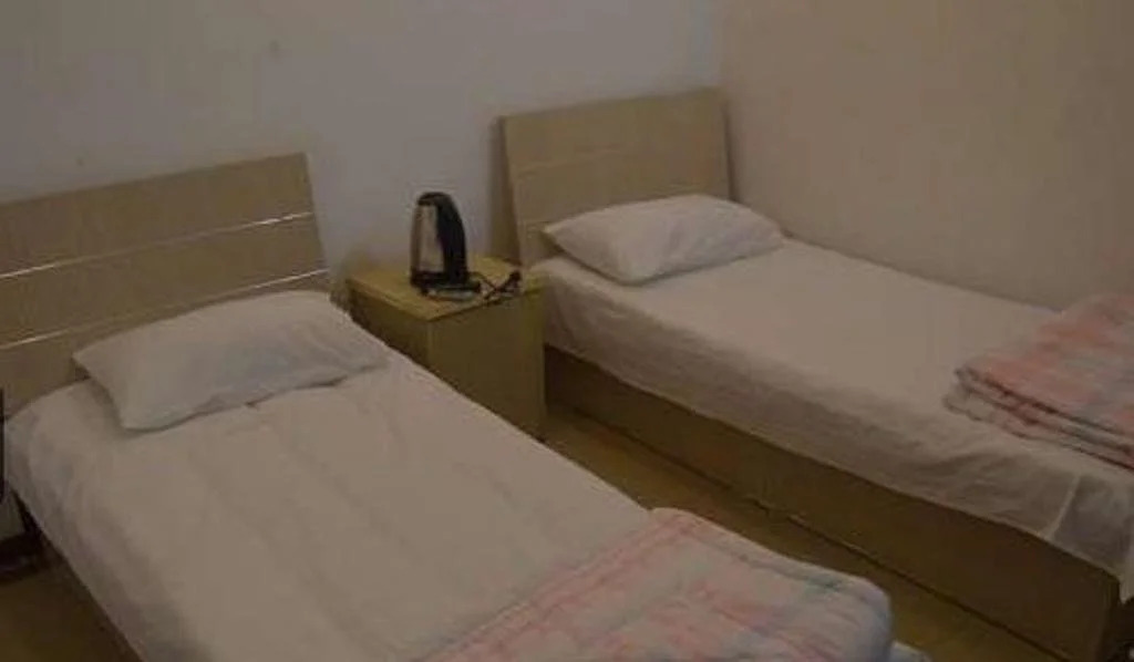 Циндао: Qingdao Guanglongju Inn