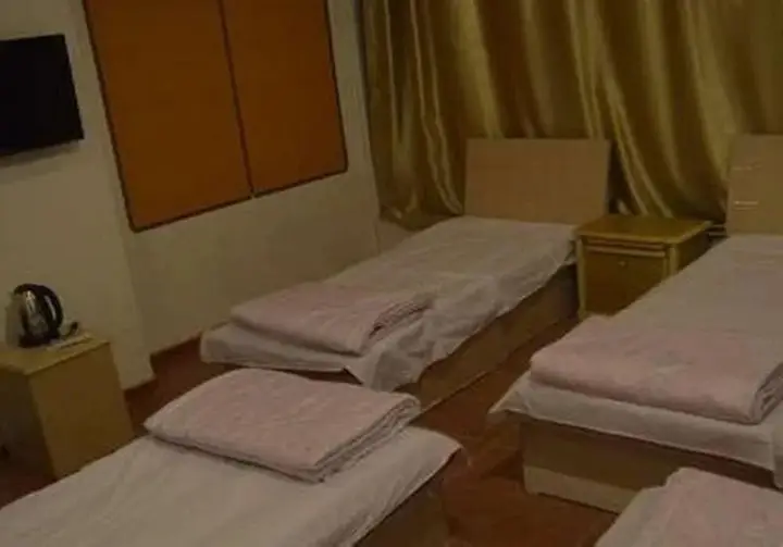 Циндао: Qingdao Guanglongju Inn