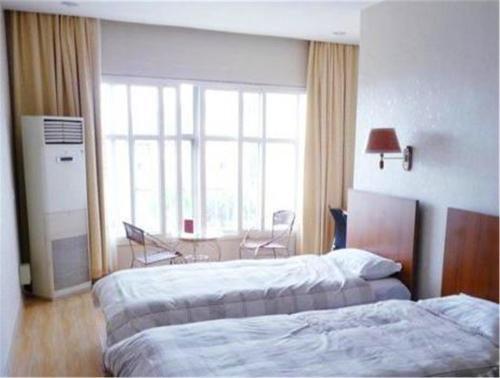 Циндао: Qingdao Ziyu Business Hotel