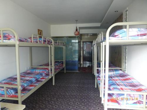 Лешан: Leshan Seven Days Sunshine Student Apartment