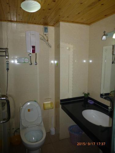 Лешан: Leshan Seven Days Sunshine Student Apartment