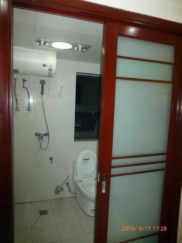 Лешан: Leshan Seven Days Sunshine Student Apartment