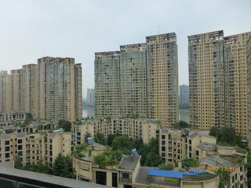 Лешан: Leshan Seven Days Sunshine Student Apartment