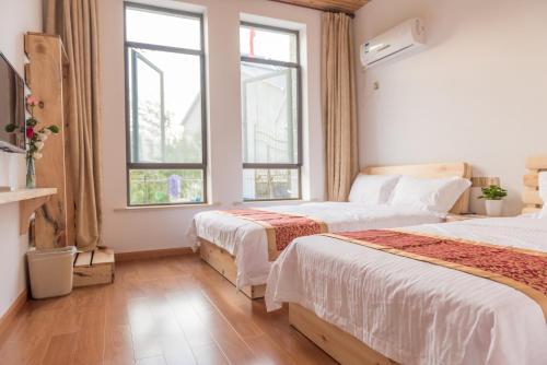 Хучжоу: Houwu Xinqing Life Inn