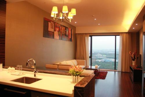 Гуанчжоу: Guangzhou Xing Yi International Apartment - Poly World Branch