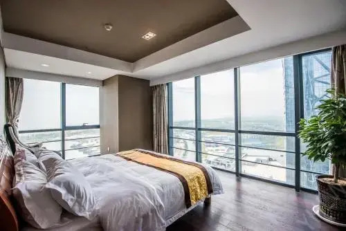 Циндао: Qingdao Yuehai Lanwan Seaview Resort Apartment