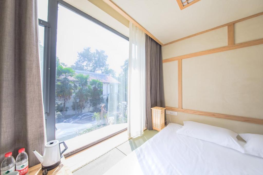 Ханчжоу: Van Wind Inn