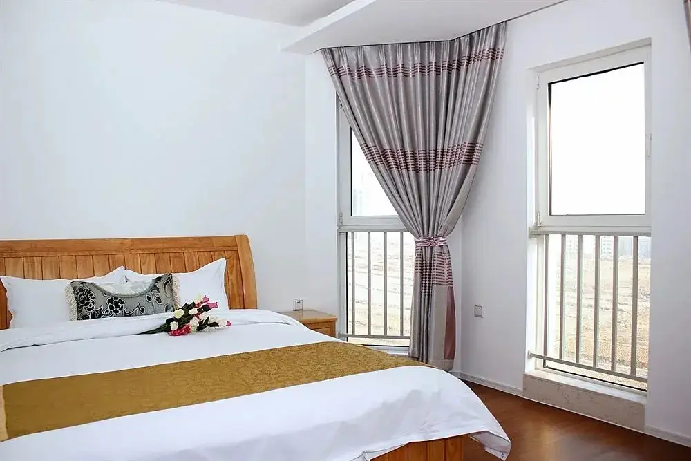Циндао: Qingdao Tujia Sweetome Vacation Rentals Golden Beach