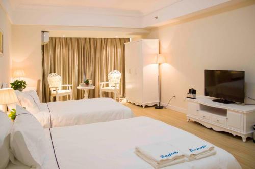 Циндао: Qingdao Bedom Apartment Jinsha Bay