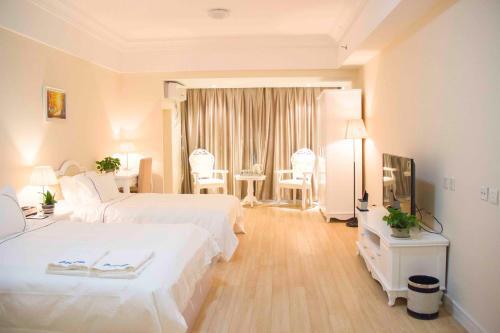 Циндао: Qingdao Bedom Apartment Jinsha Bay