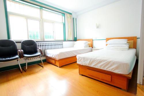 Циндао: Qingdao Shengdi Inn