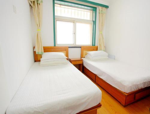 Циндао: Qingdao Shengdi Inn
