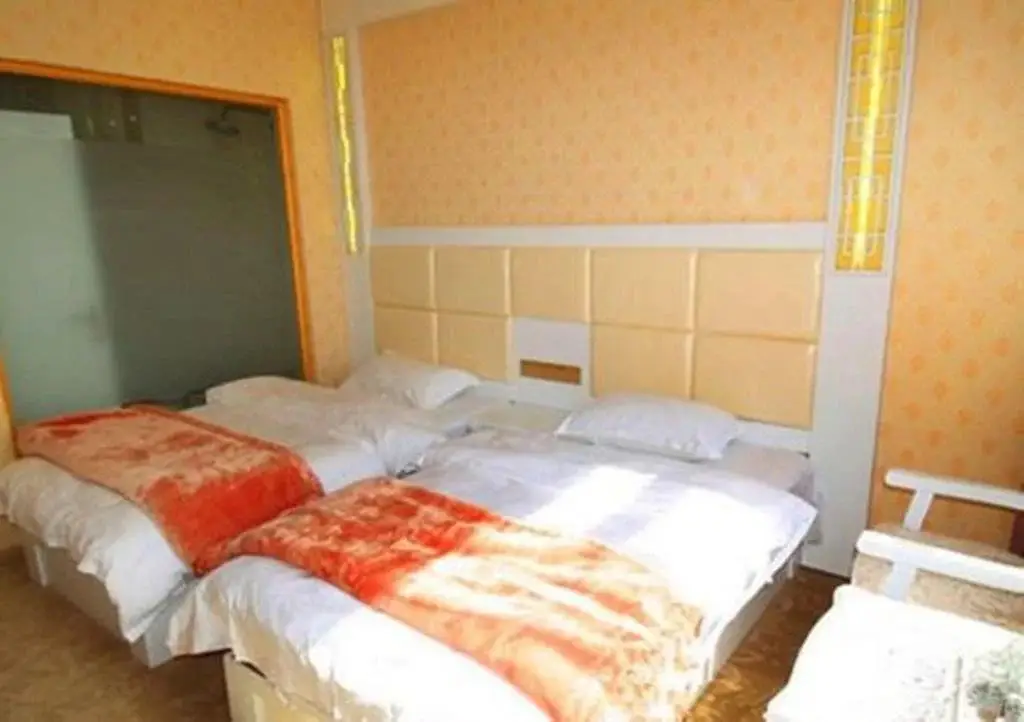Дали: Mingge Busniess Hotel