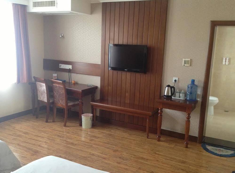 Циндао: Izunco Inn Qingdao TV Mansion