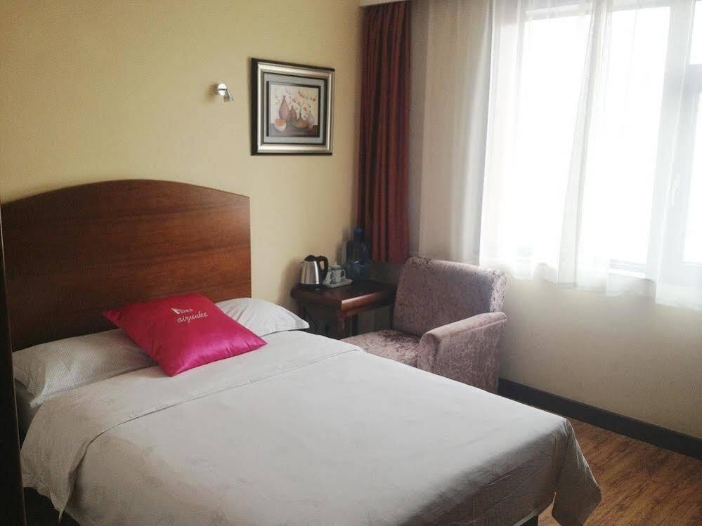 Циндао: Izunco Inn Qingdao TV Mansion