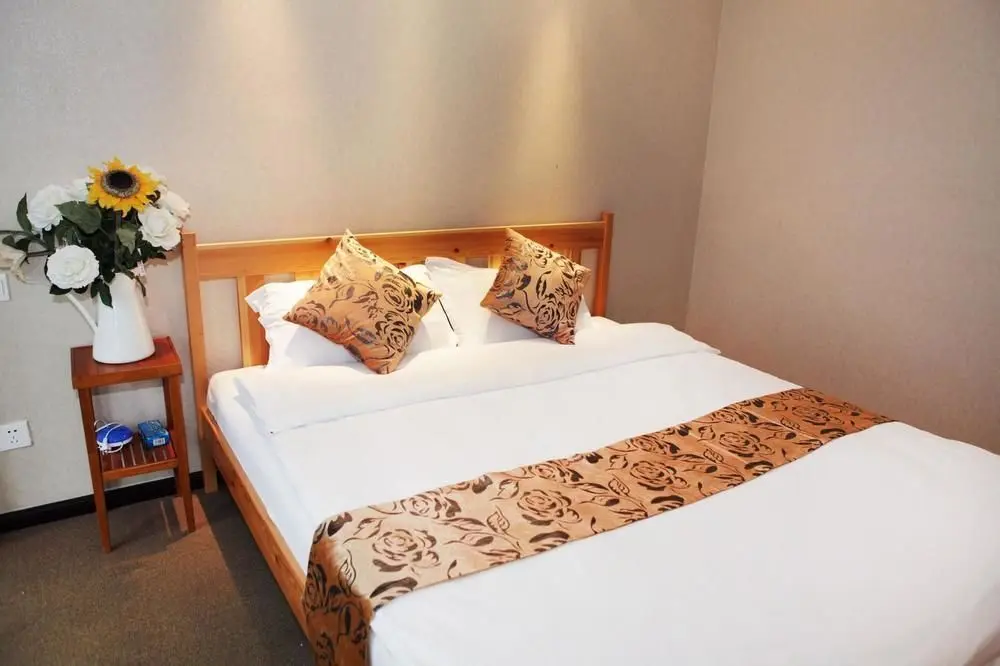 Далянь: Yijia Hotel Apartment Dalian (Xinghai Daguan)