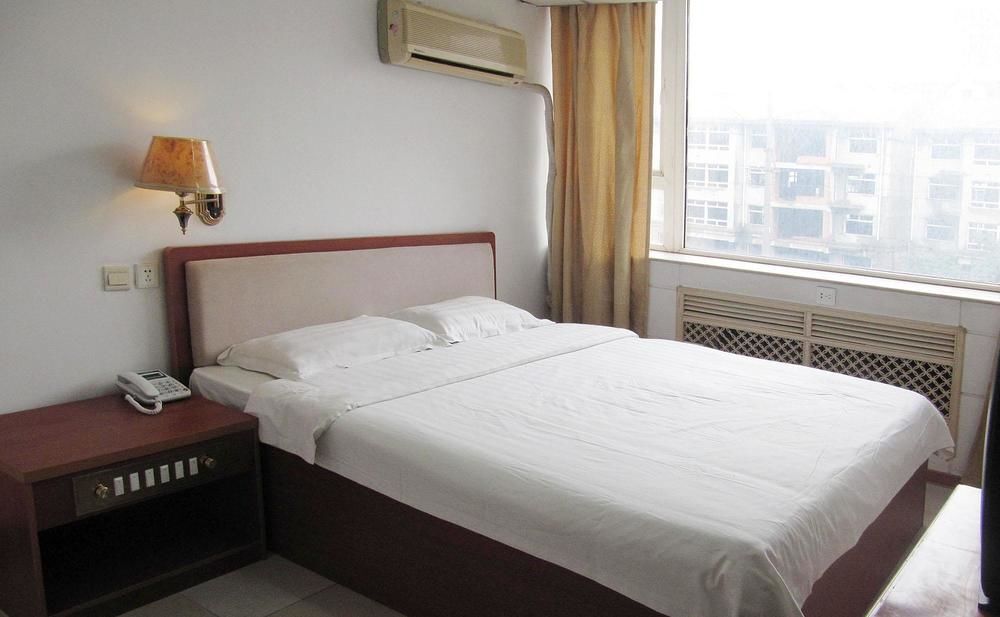 Далянь: Xinyue Business Hotel