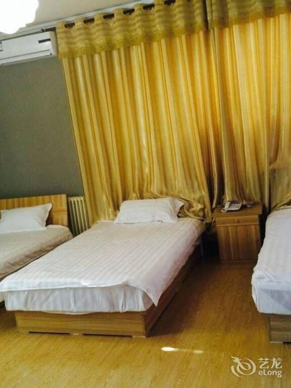 Циндао: Jiawang Family Apartment Hotel