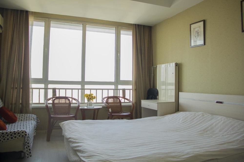 Циндао: Qingdao Noah Tourist Apartment (CBD Wanda Plaza)