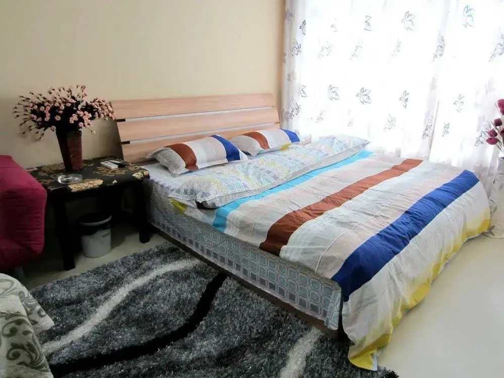 Циндао: Qingdao Noah Tourist Apartment (CBD Wanda Plaza)