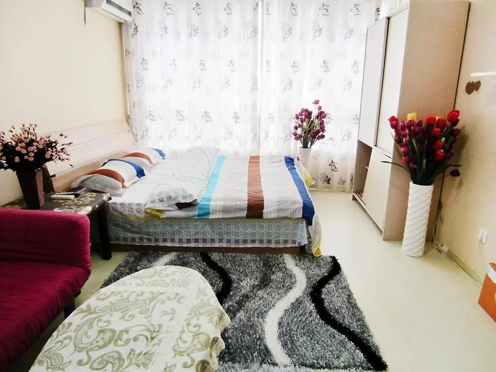 Циндао: Qingdao Noah Tourist Apartment (CBD Wanda Plaza)