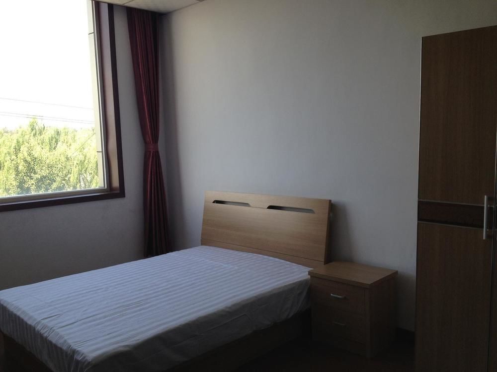 Пекин: Beijing Gujia Hotel Apartment