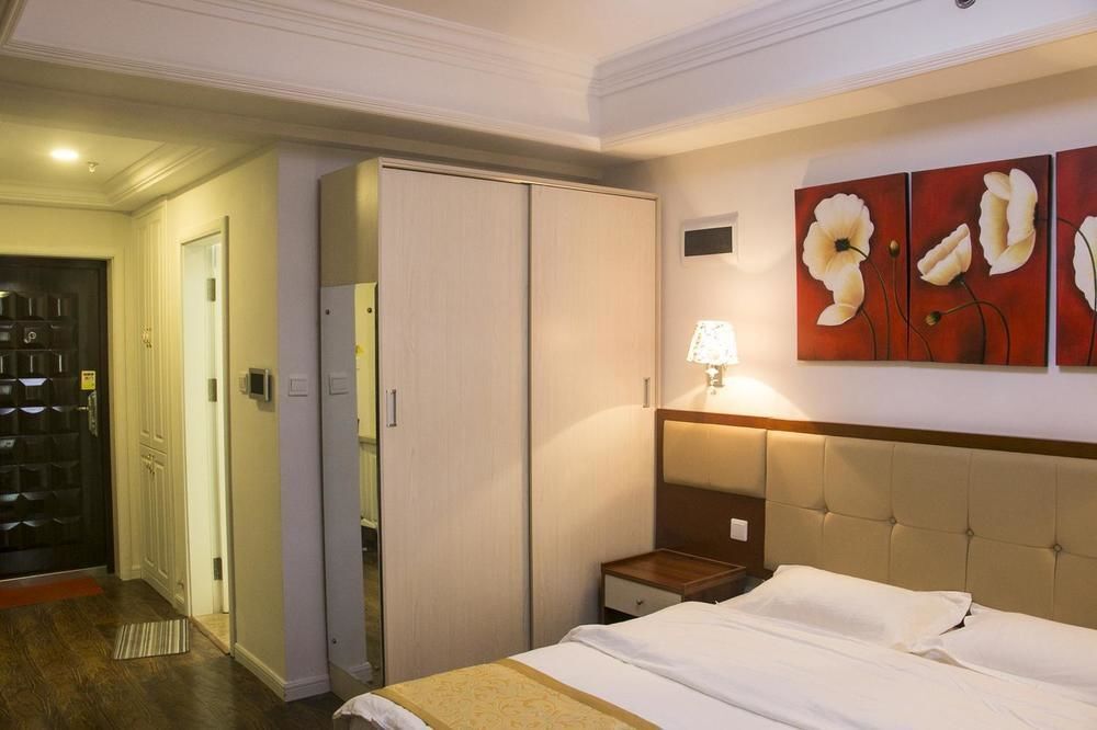 Циндао: Yiyaju Hotel Apartment Qingdao 7080 Central Square