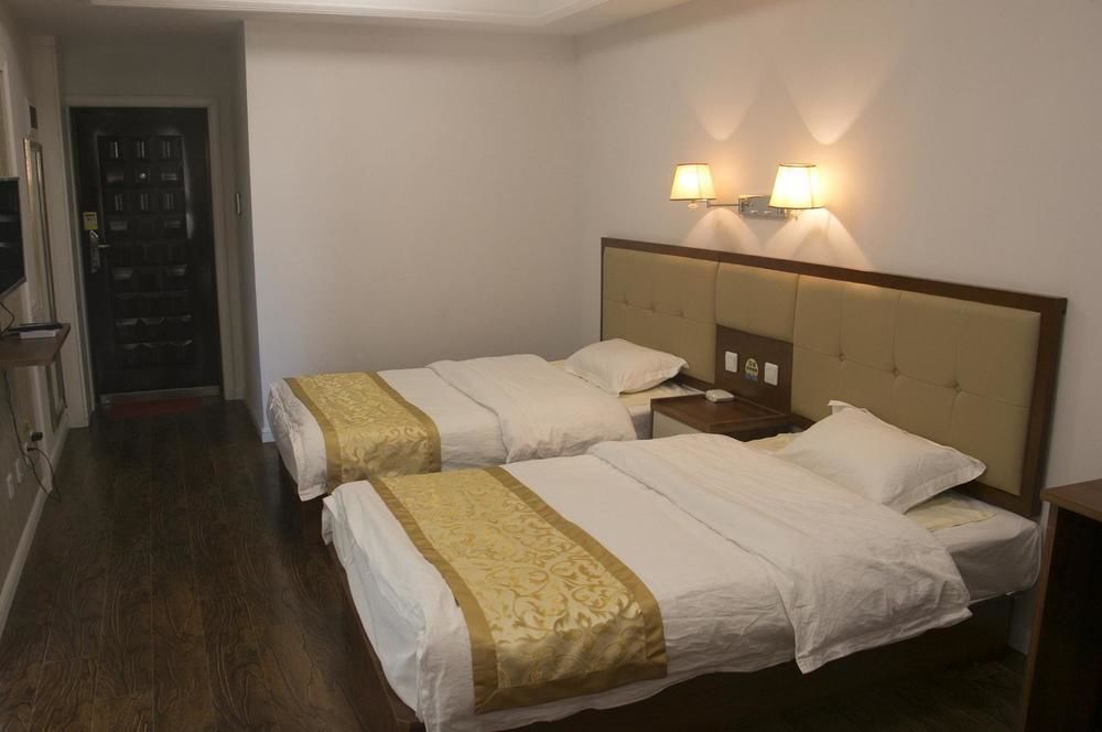 Циндао: Yiyaju Hotel Apartment Qingdao 7080 Central Square