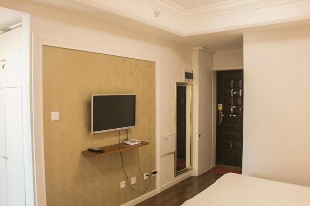 Циндао: Yiyaju Hotel Apartment Qingdao 7080 Central Square