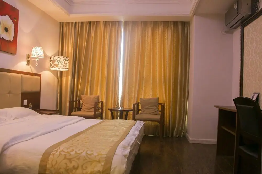 Циндао: Yiyaju Hotel Apartment Qingdao 7080 Central Square