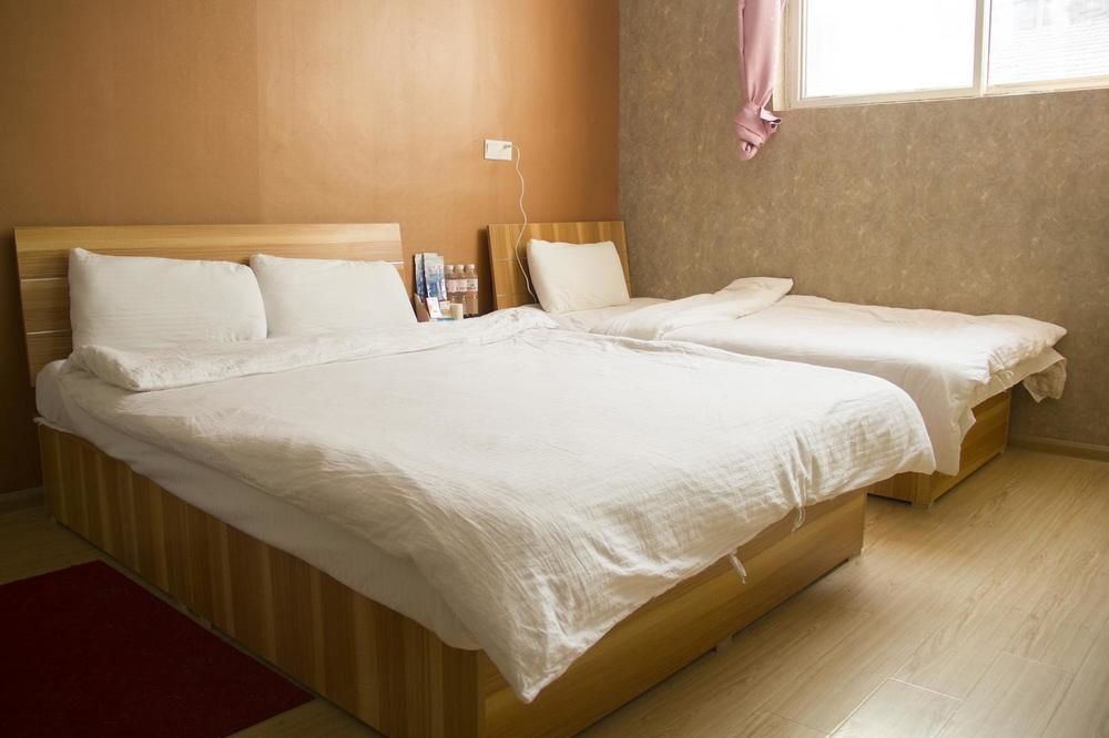 Циндао: Qingdao Qianshanhouhai Apartment
