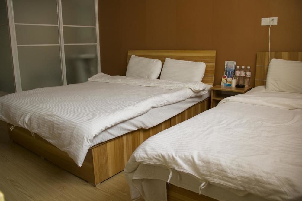 Циндао: Qingdao Qianshanhouhai Apartment