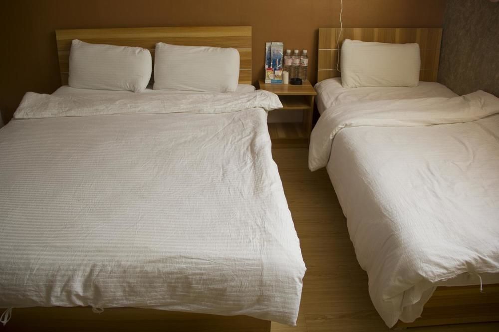 Циндао: Qingdao Qianshanhouhai Apartment
