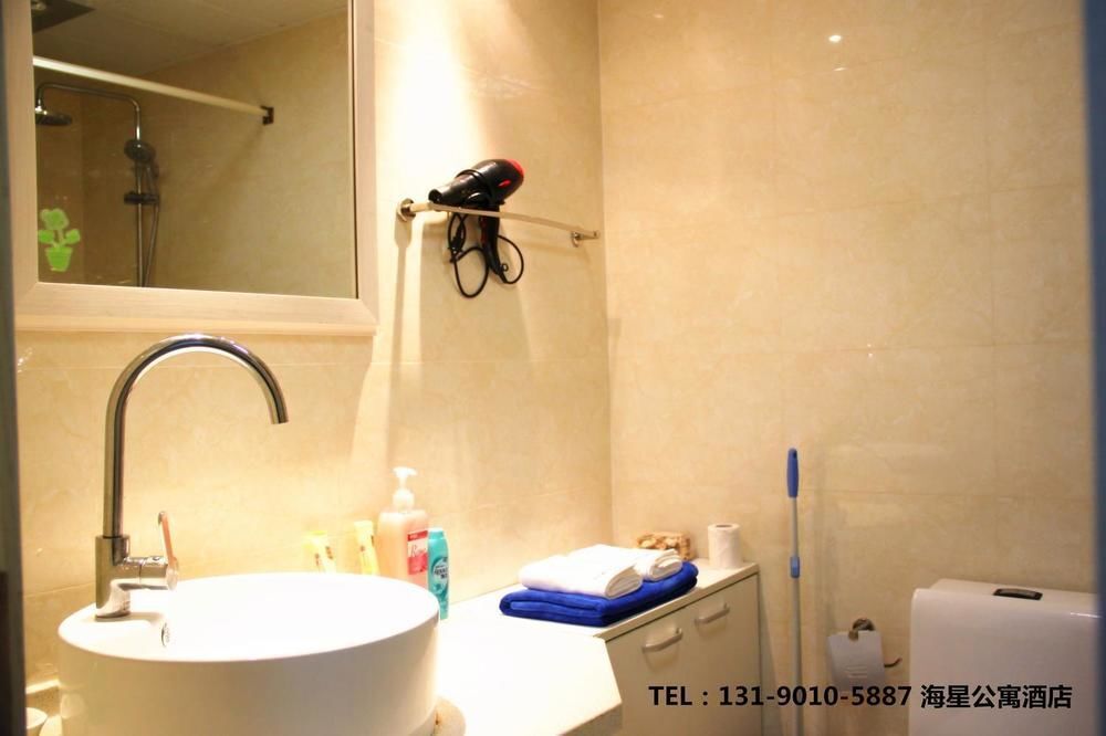 Далянь: Dalian Sanxing Mansion Starfish Hotel Apartment
