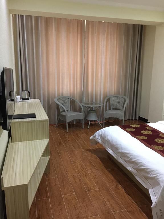 Цзюцюань: Super 8 by Wyndham Jiuquan Jinta Bus Station Jiu Hang Lu