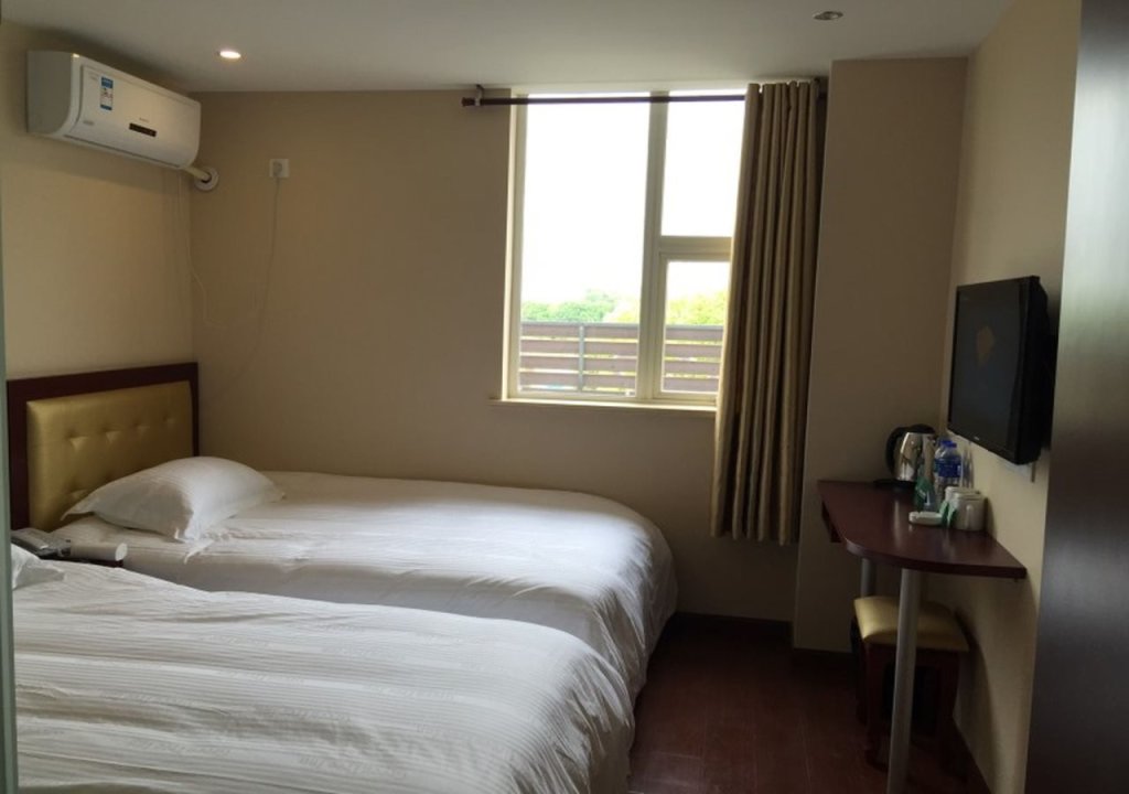 Шанхай: GreenTree Inn Shanghai National Convention And Exhibition Center Xujing North City Subway Station Shell Hotel